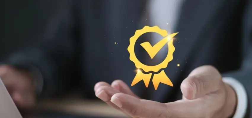 Business professional managing quality management system dashboard representing ISO 9001 certification implementation