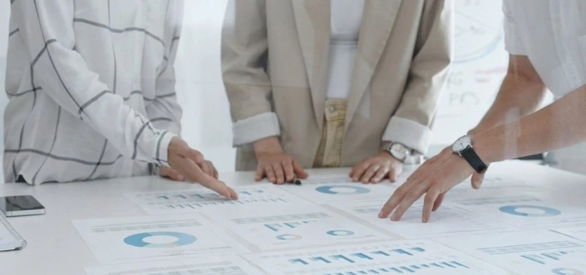 Consultant explaining ISO certification pricing and process to business team in Bahrain